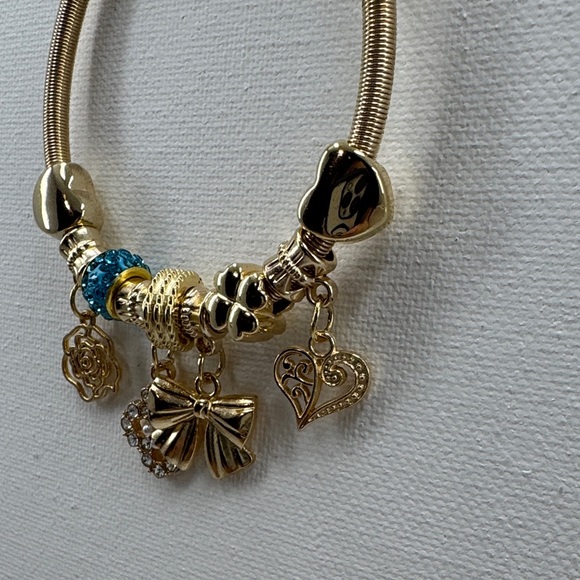Gold tone Charm stretchy Bracelet with Blue Accents - Picture 4 of 5